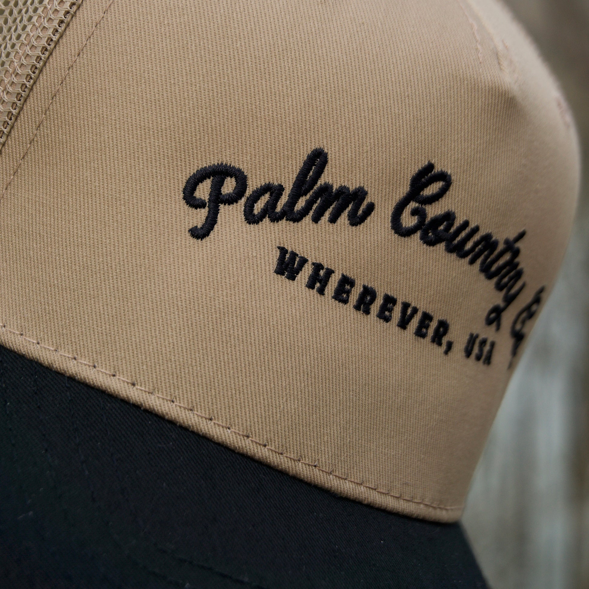 a hat with a palm beach wherever embroidered on it